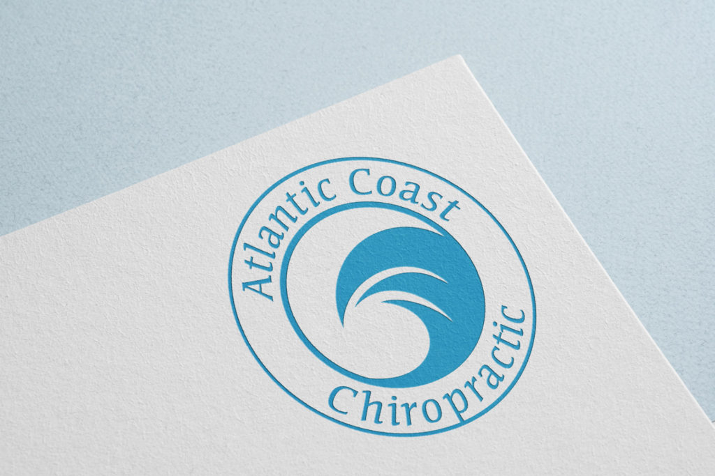 A white sheet of paper printed in the top corner with a round Atlantic Coast Chiropractic logo sits on a light blue background. The logo features a blue stylized wave inside a circle, which is inside a larger concentric blue circle. The words 'Atlantic Coast Chiropractic' (also blue) are printed around the space between the inner and outer circles.